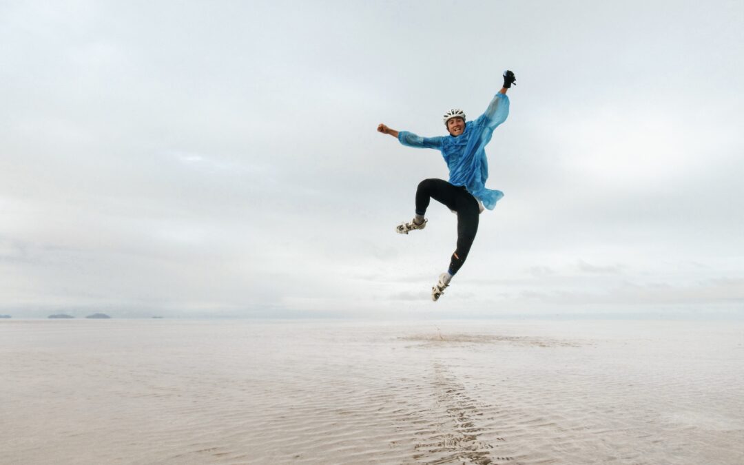Person Jumping in the air in a dessert.